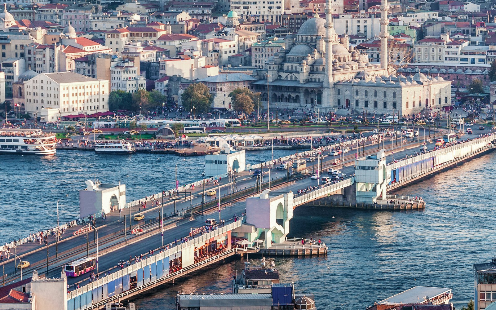 Galata Tower view with Galata Bridge spanning the Golden Horn in Istanbul.