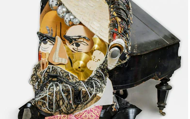 Collage sculpture of a face made from musical instruments at IAM Illusion Art Museum, Prague.