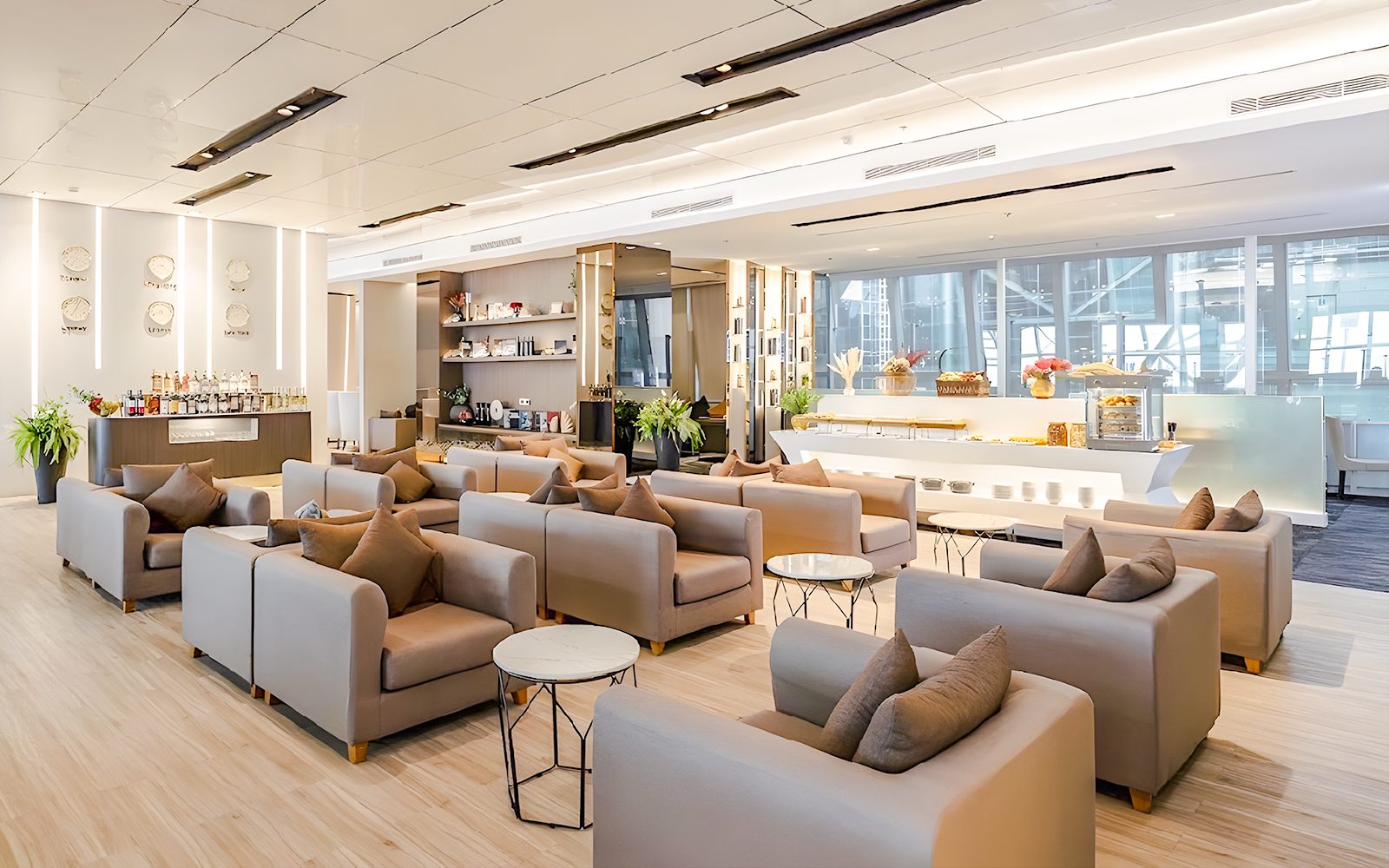 Miracle Lounge seating area with refreshments at Bangkok Airport, Thailand.