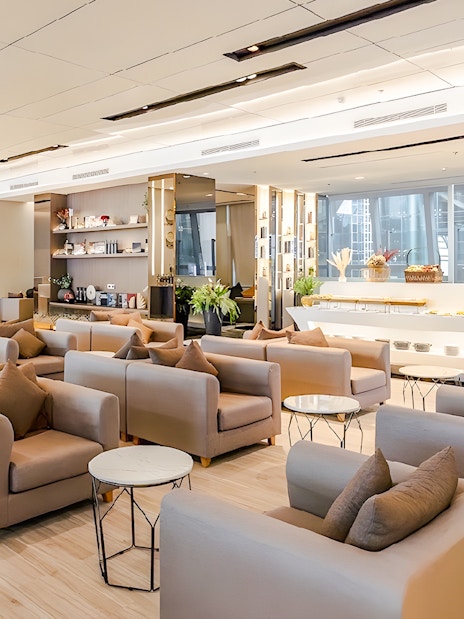 Miracle Lounge seating area with refreshments at Bangkok Airport, Thailand.