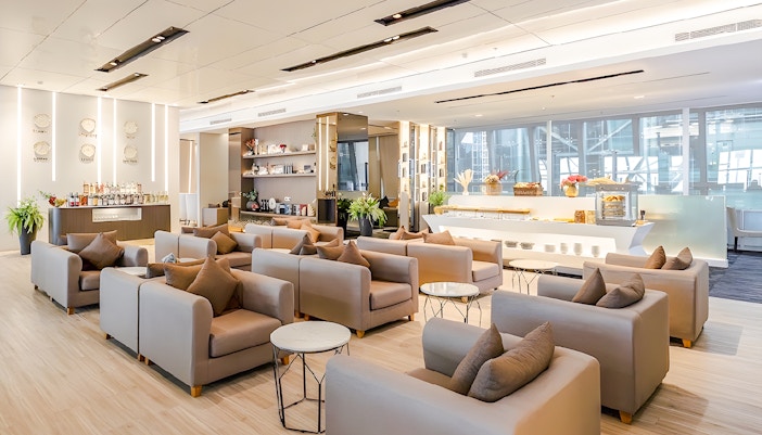 Miracle Lounge seating area with refreshments at Bangkok Airport, Thailand.