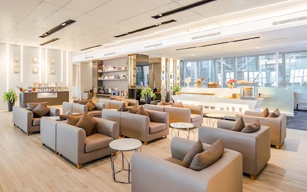 Miracle Lounge seating area with refreshments at Bangkok Airport, Thailand.