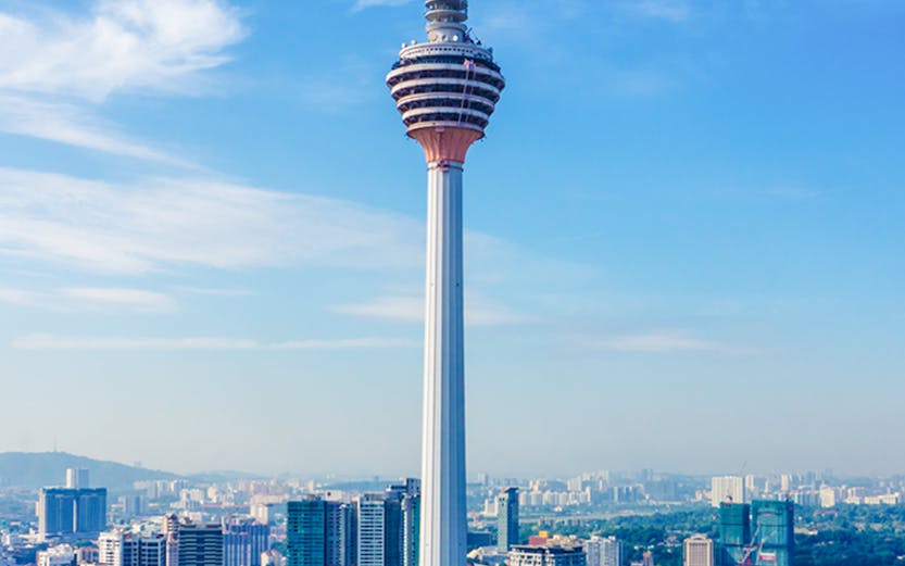 Kuala Lumpur Tower against city skyline, Malaysia Deals & Offers.