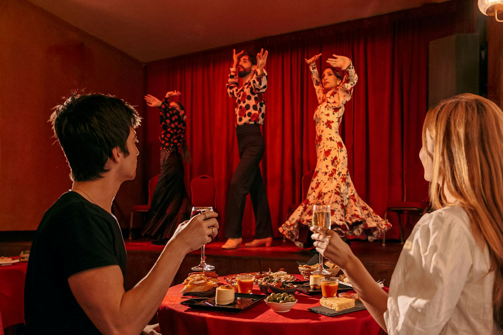 Flamenco dancers performing on stage at Laietana, Barcelona, with audience dining.