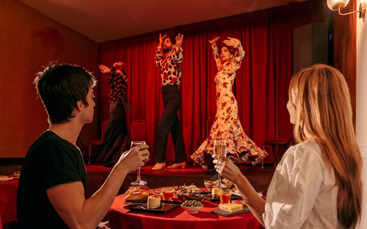 Flamenco dancers performing on stage at Laietana, Barcelona, with audience dining.