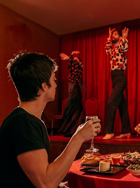 Flamenco dancers performing on stage at Laietana, Barcelona, with audience dining.