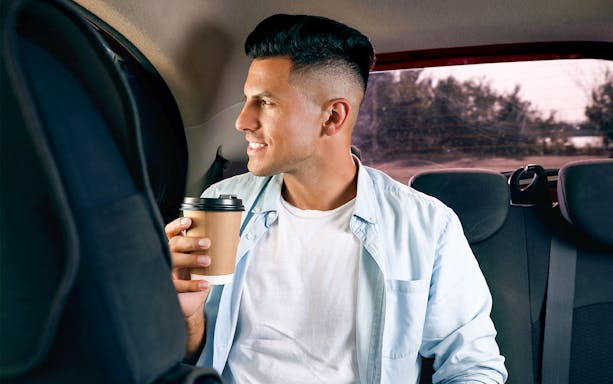 Man enjoying coffee during private transfer from New Istanbul Airport.
