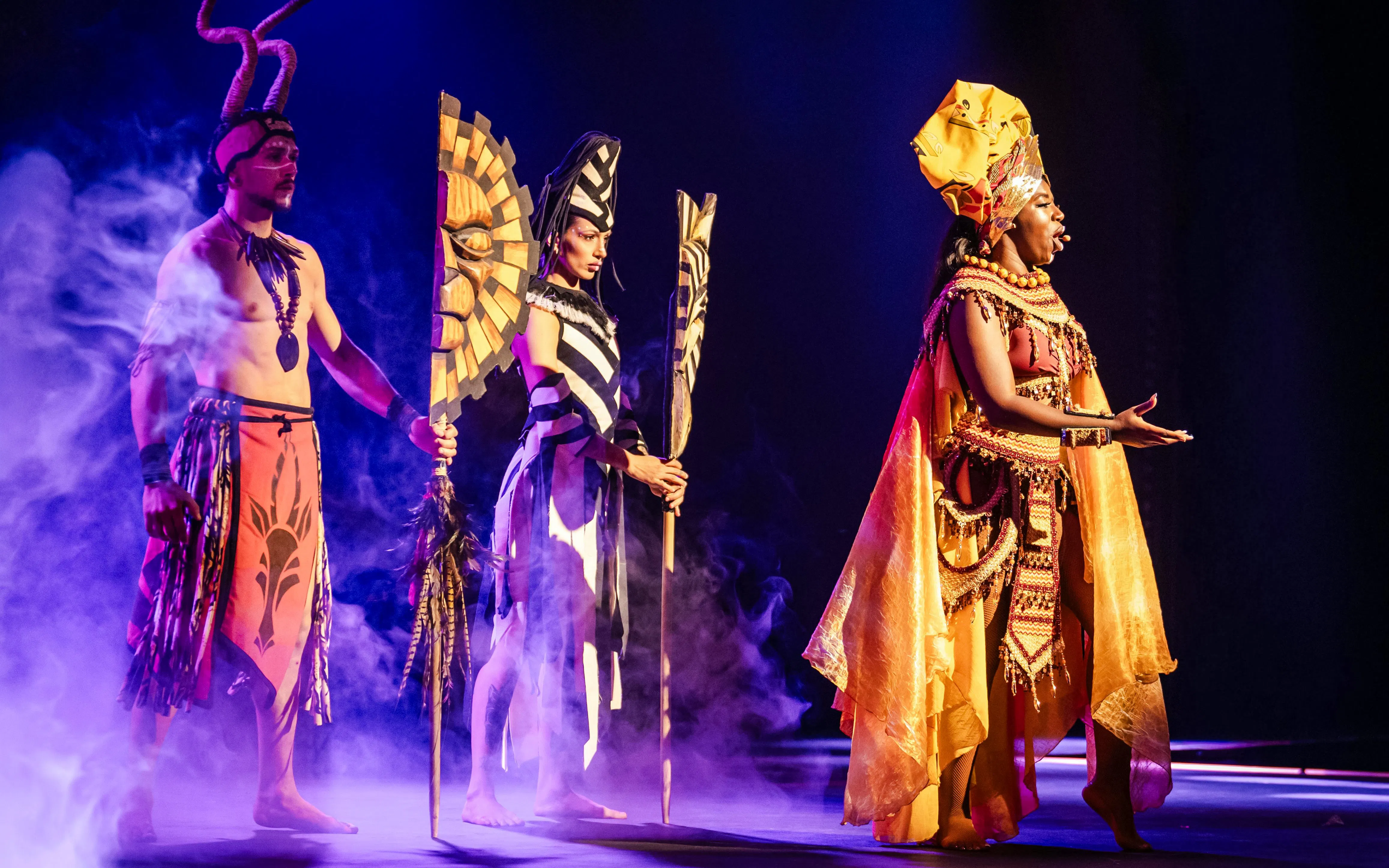 Performers in vibrant costumes on stage at Sala Scala, Gran Canaria.