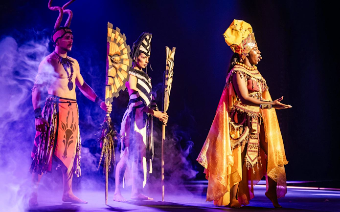 Performers in vibrant costumes on stage at Sala Scala, Gran Canaria.