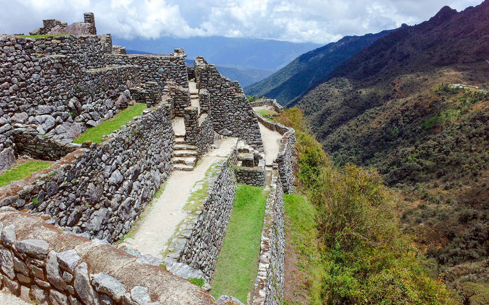 Sayacmarca ruins on the Inca Trail with stone walls and mountain views.