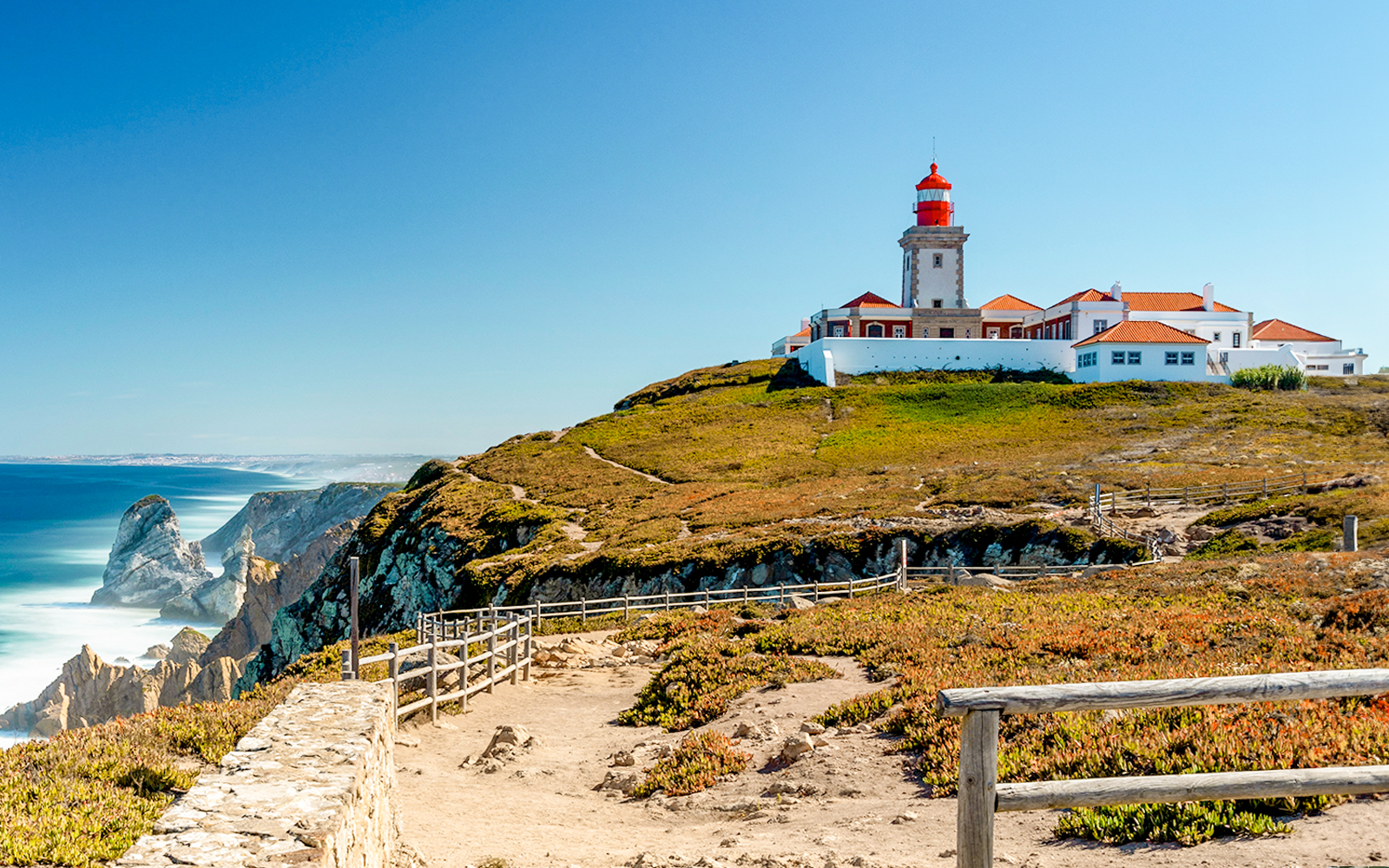 Cabo da Roca lighthouse on a cliff overlooking the Atlantic Ocean in Portugal.