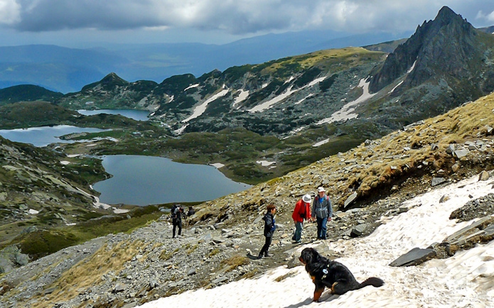 Guests hiking near Rila Lakes with mountain views in Bulgaria.