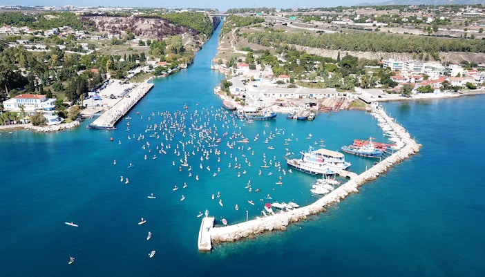 Aerial view of Corinth Canal with boats and paddleboarders, part of Nafplio-Mycenae-Epidaurus Day Tour.
