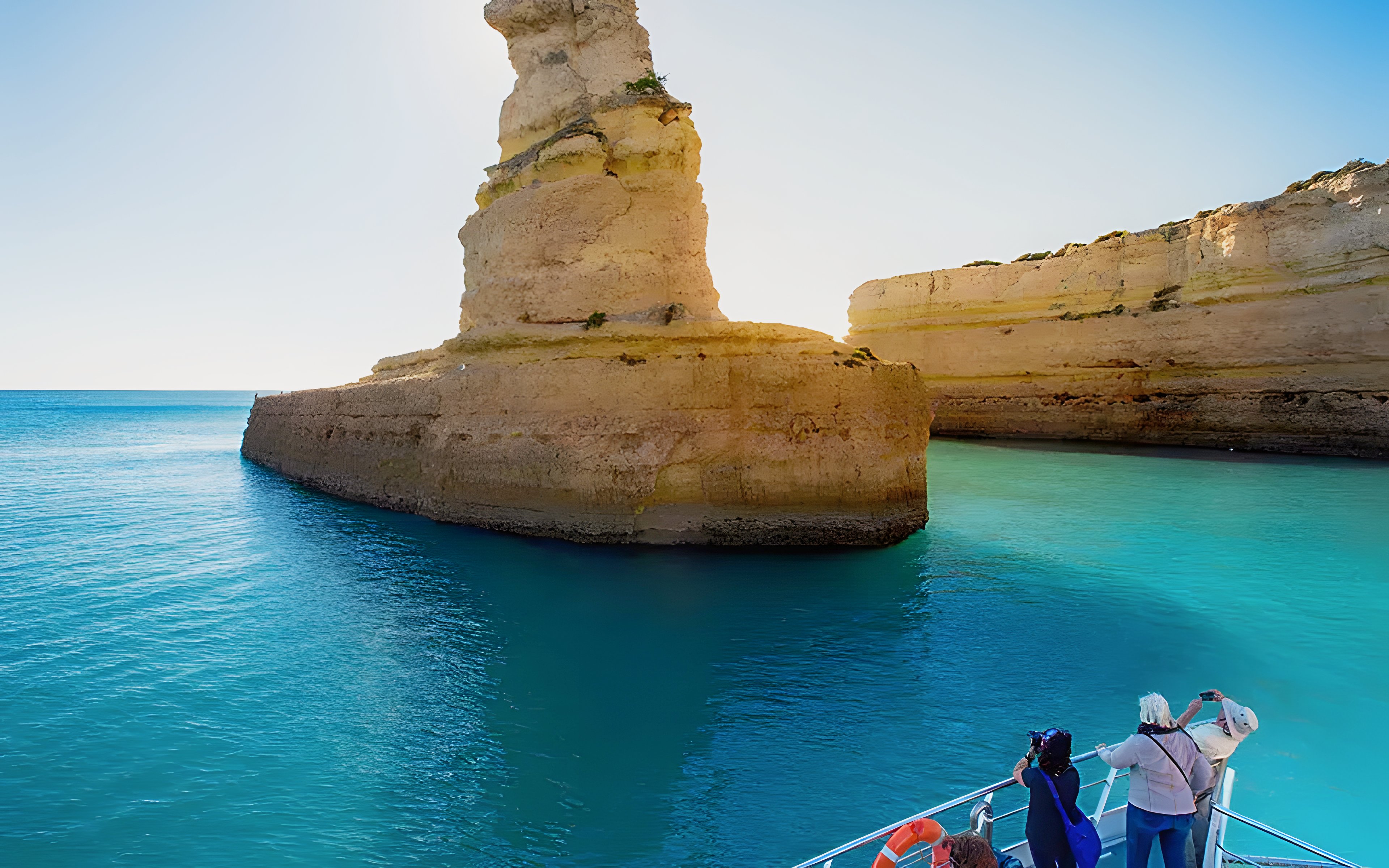 Tourists on a boat near Benagil Caves, Algarve, Portugal.