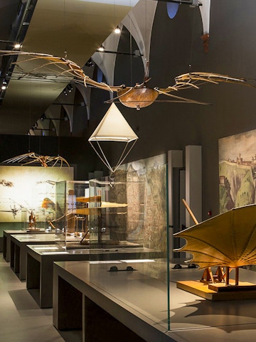 Exhibit of historical flying machines at MuSt: Museum of Science and Technology.