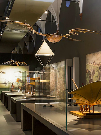 Exhibit of historical flying machines at MuSt: Museum of Science and Technology.