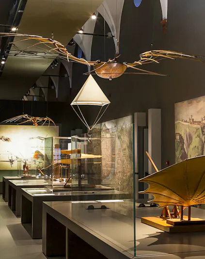 Exhibit of historical flying machines at MuSt: Museum of Science and Technology.