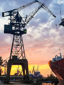 Shipyard crane at sunset during Solidarity & Shipyard Tour.