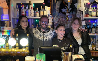 Group enjoying Reykjavík bar with local guide and drinks.