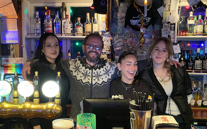 Group enjoying Reykjavík bar with local guide and drinks.