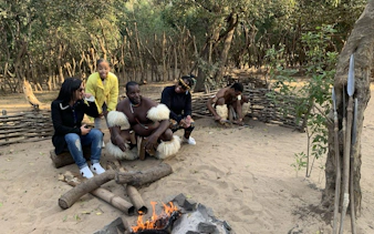 Visitors engaging with local culture at a traditional Zulu village near Durban.