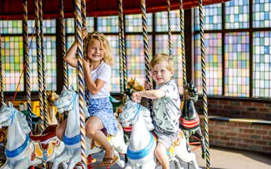 Children riding a merry-go-round at Wild West in Slagharen.