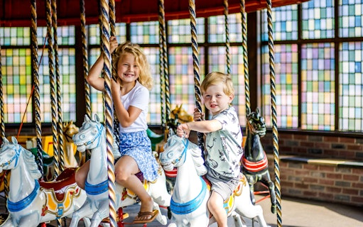 Children riding a merry-go-round at Wild West in Slagharen.