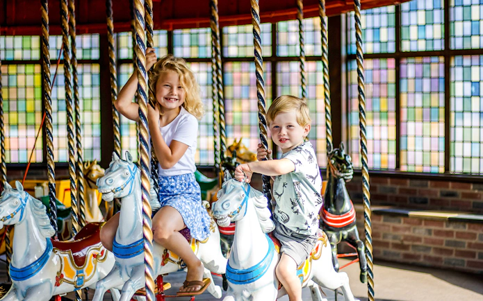 Children riding a merry-go-round at Wild West in Slagharen.