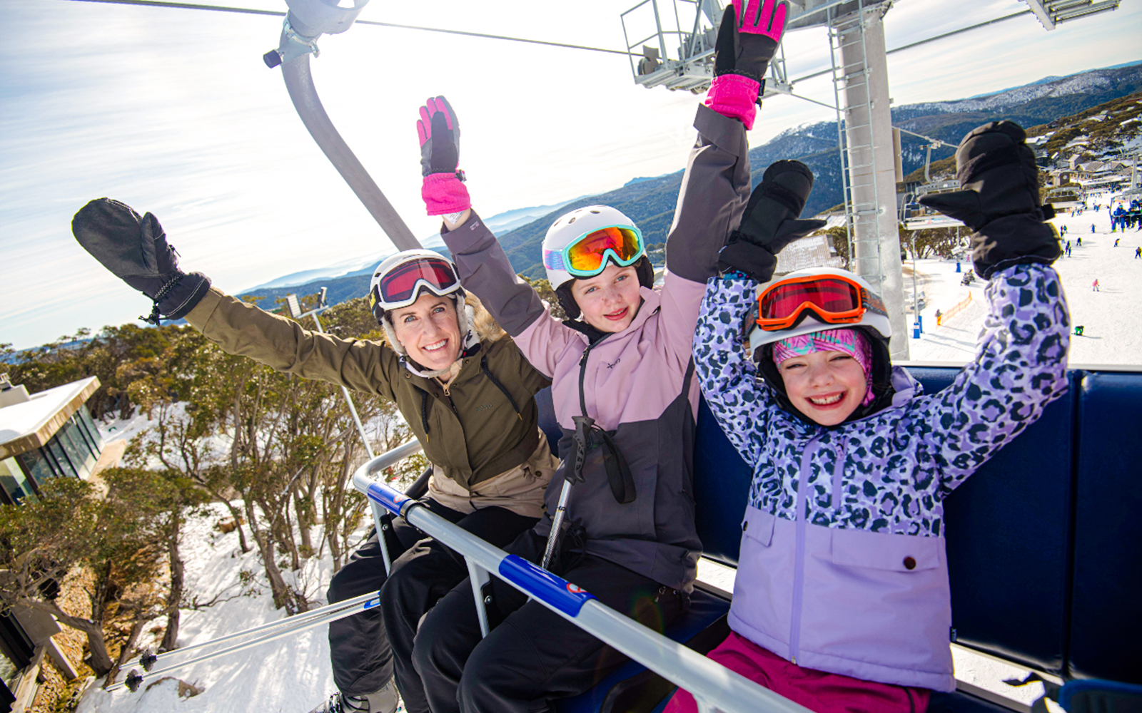 People enjoying a ski lift ride at Mt Buller, Australia.