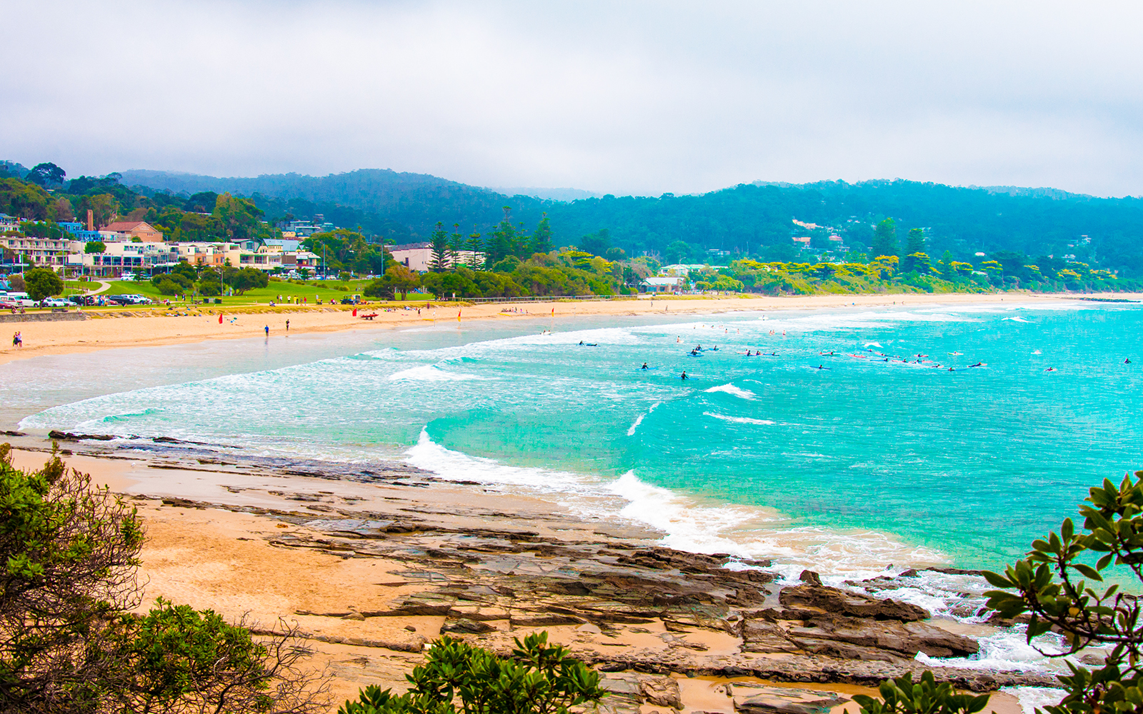 Lorne Beach along Great Ocean Road with waves and sandy shoreline.