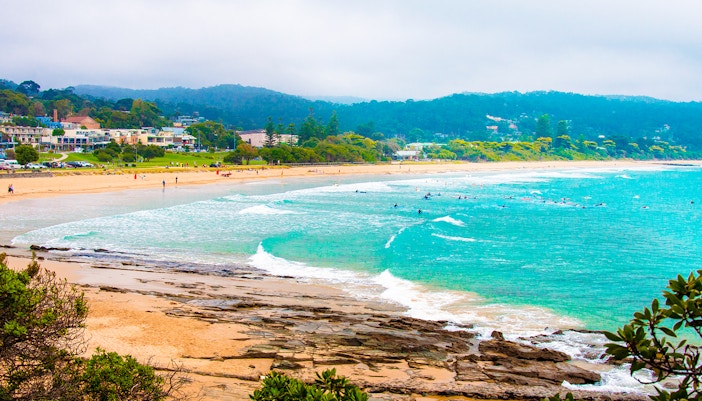 Lorne Beach along Great Ocean Road with waves and sandy shoreline.