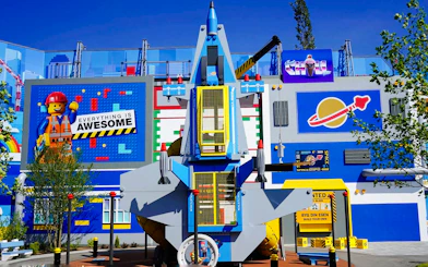 Benny's Playship attraction at LEGOLAND Billund with colorful LEGO-themed decor.