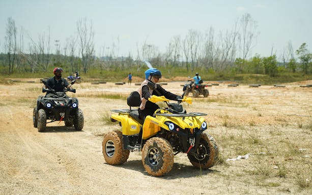 ATV riders exploring trails at Discovery Park, Gamuda Cove.