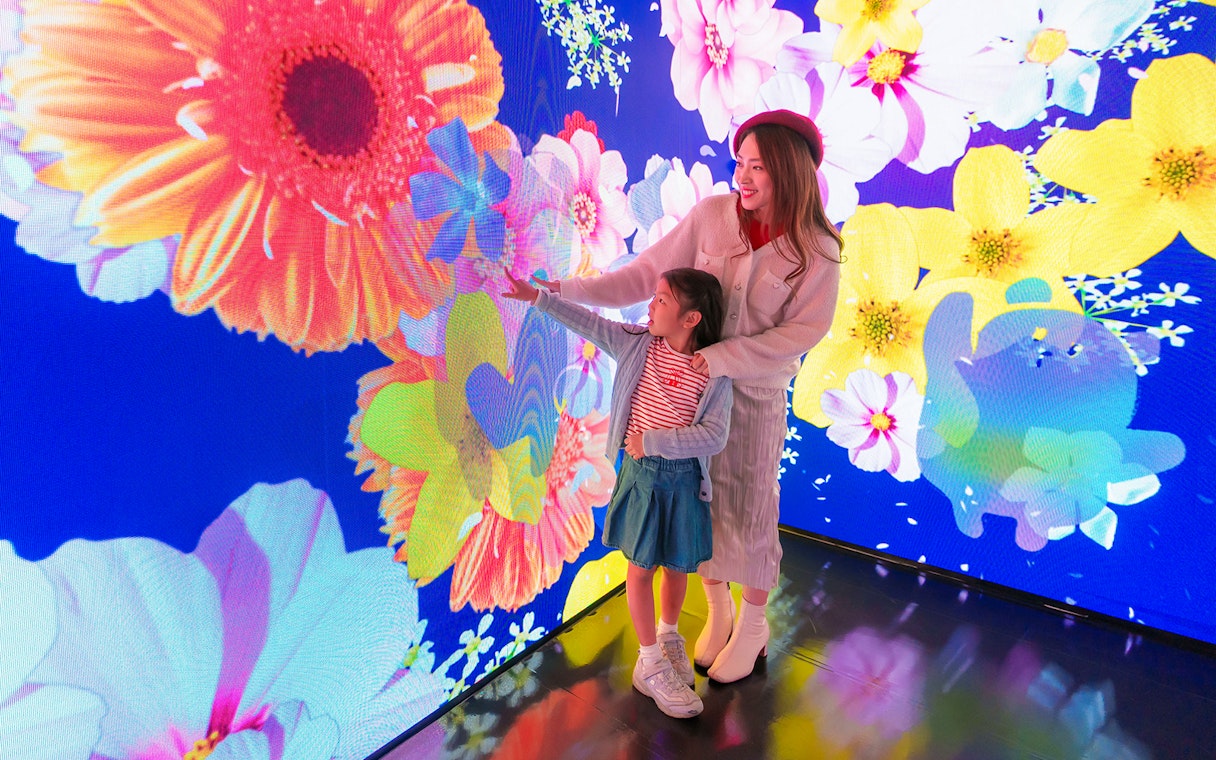 Visitors enjoying digital floral display at Ocean Park Hong Kong.