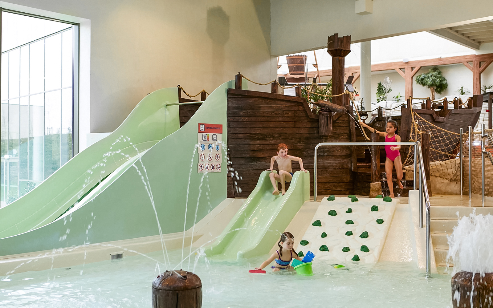 Children playing on slides and in water at Bellewaerde Aquapark, Ypres.