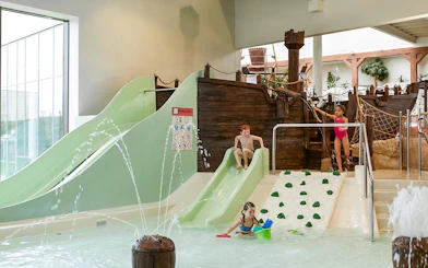 Children playing on slides and in water at Bellewaerde Aquapark, Ypres.