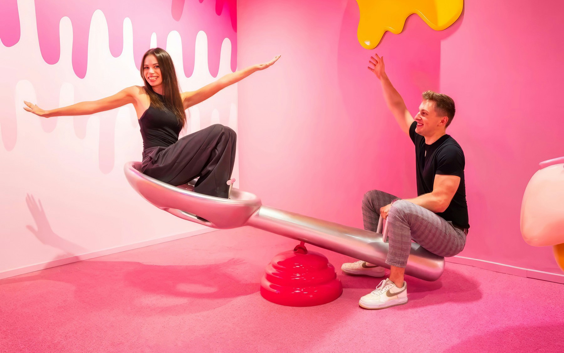 Visitors enjoying a seesaw at the Museum of Candy in Dubai.