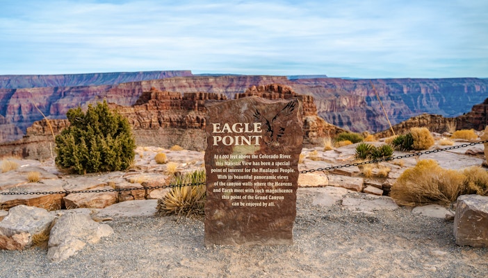 Eagle Point sign at Grand Canyon West with scenic canyon view, Arizona, USA.