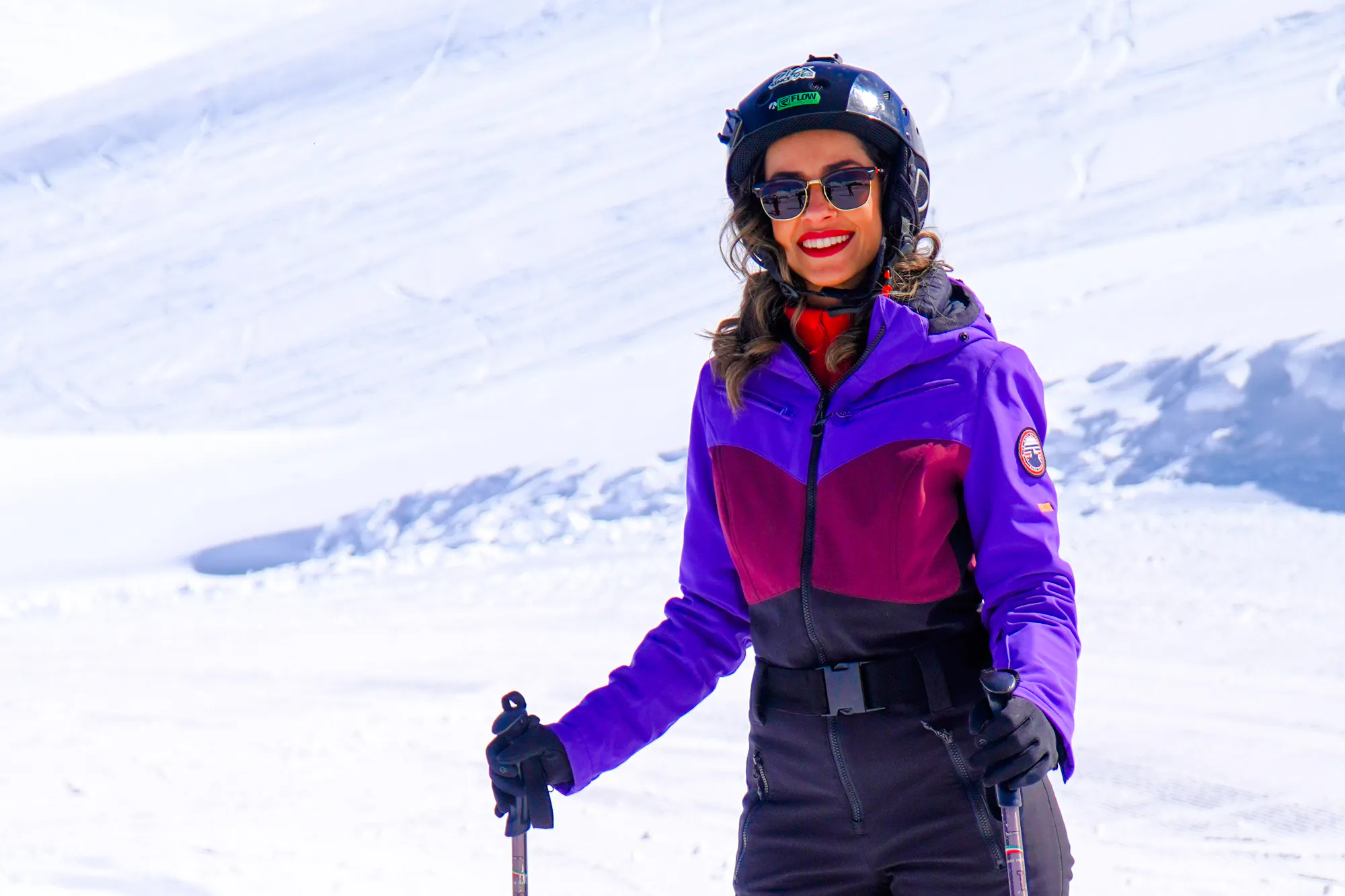 Skier in Valle Nevado with gear, enjoying a sunny day on the slopes, Santiago.
