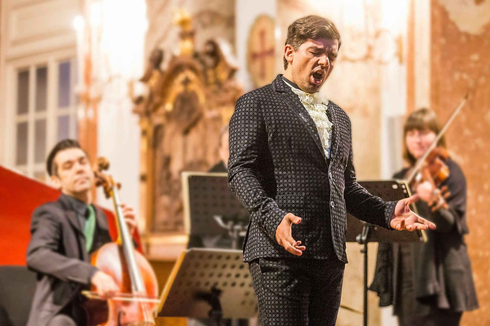 Musicians performing Vivaldi's Four Seasons at Karlskirche, Vienna, with audience in view.