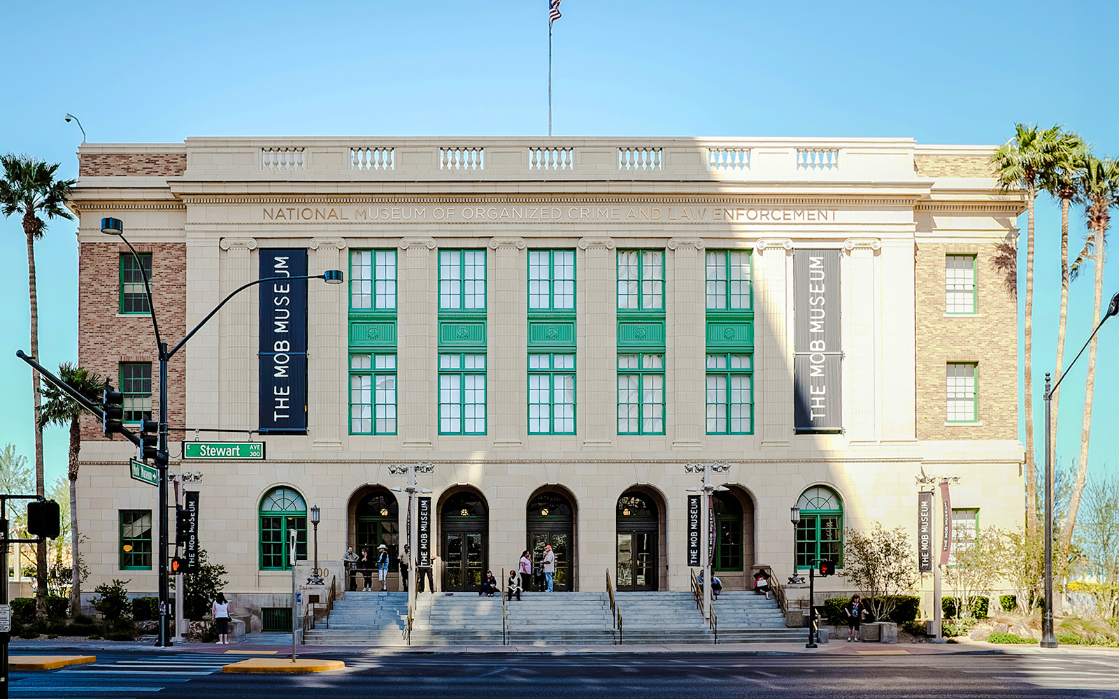 Mob Museum entrance in Las Vegas with visitors on steps.