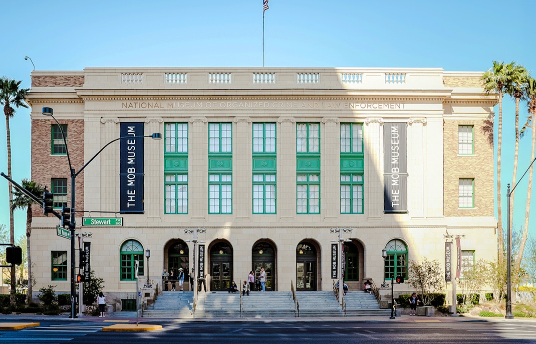 Mob Museum entrance in Las Vegas with visitors on steps.