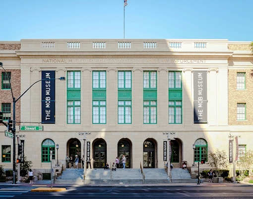 Mob Museum entrance in Las Vegas with visitors on steps.