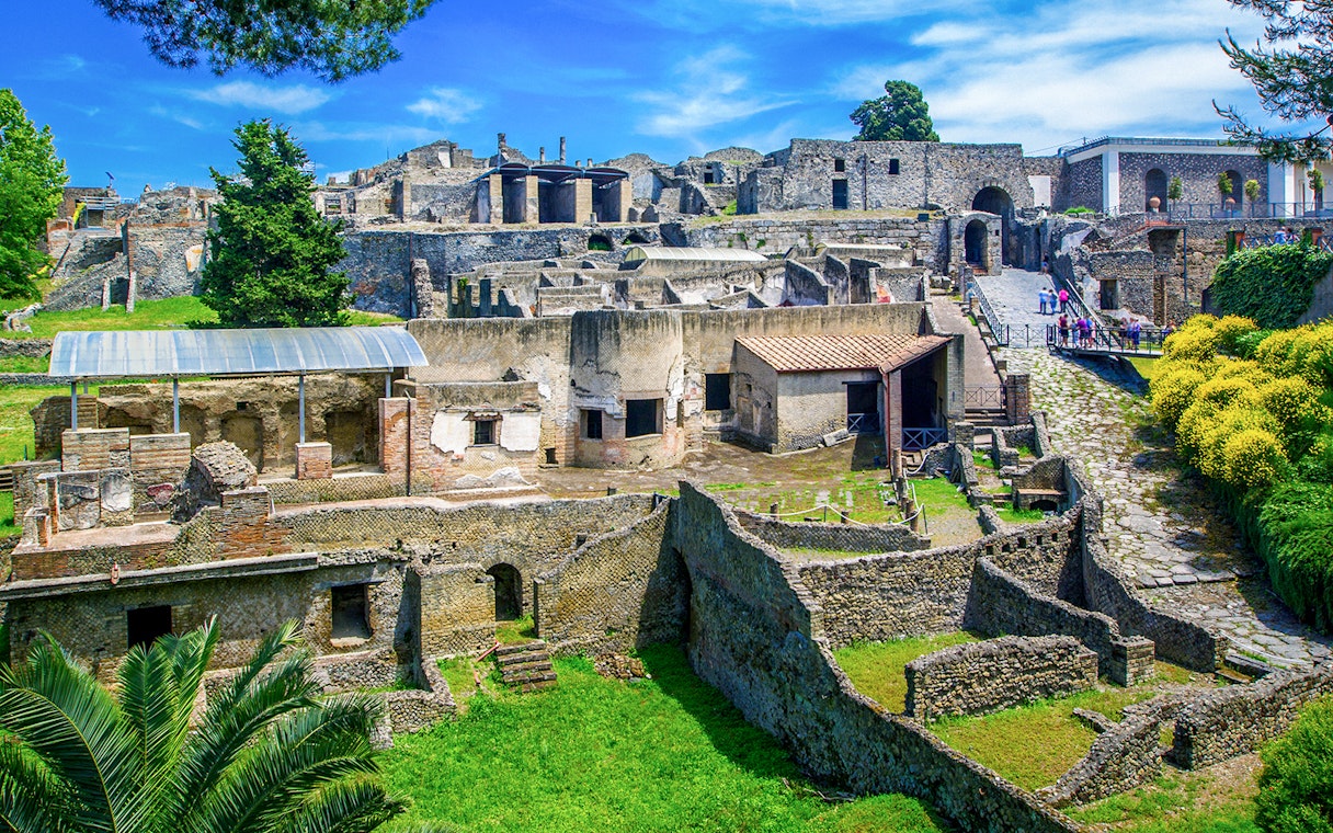 Ancient ruins of Pompeii with stone houses and streets in Naples, Italy.