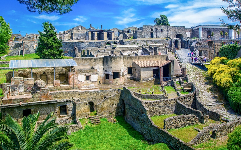 Ancient ruins of Pompeii with stone houses and streets in Naples, Italy.