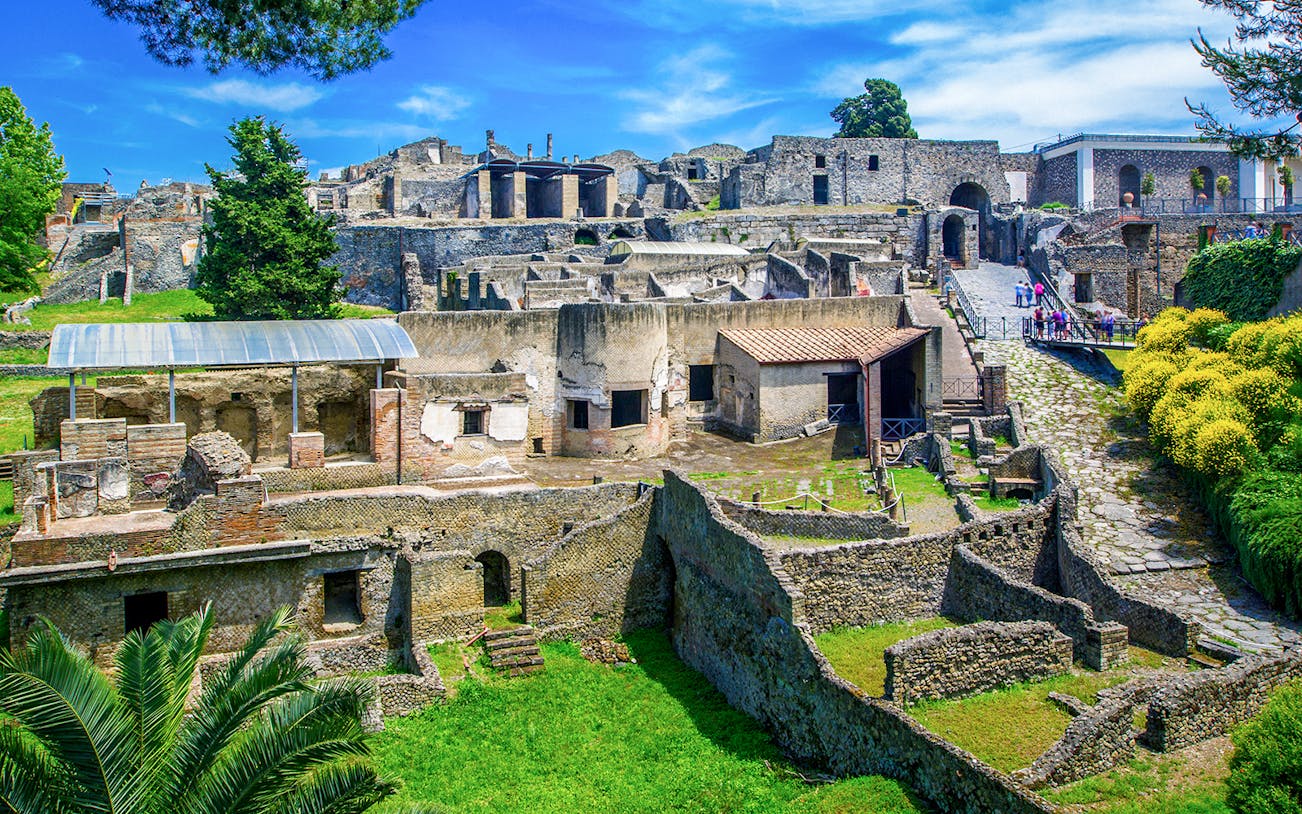 Ancient ruins of Pompeii with stone houses and streets in Naples, Italy.