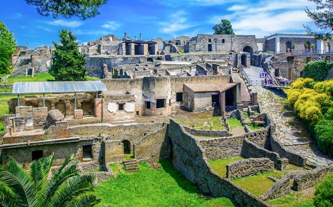 Ancient ruins of Pompeii with stone houses and streets in Naples, Italy.