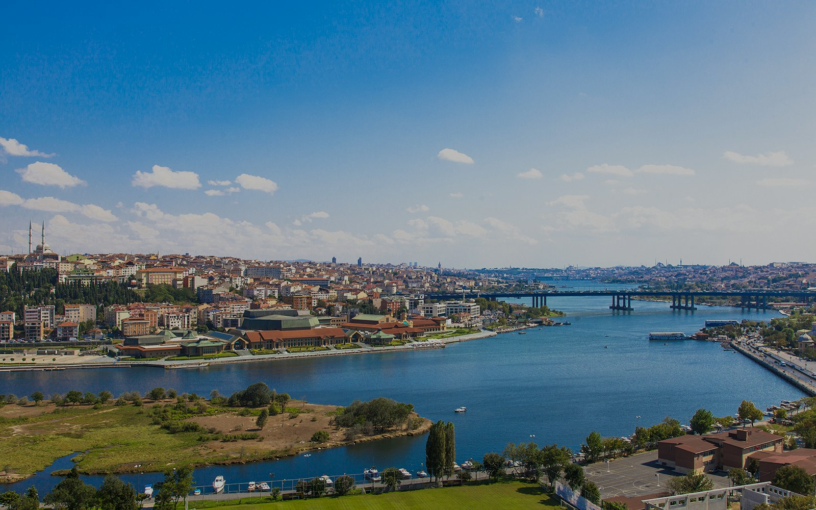 Golden Horn waterway in Istanbul with cityscape and boats.