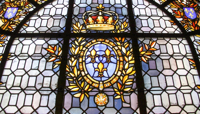 Basilica of Saint-Denis exterior with Gothic architecture and intricate stained glass windows in Paris, France.