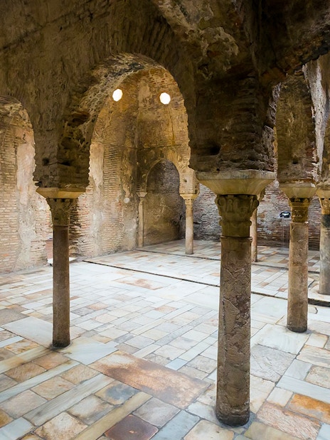 Interior of ancient Arab bathhouse with stone arches in Albaicin, Granada, Spain.